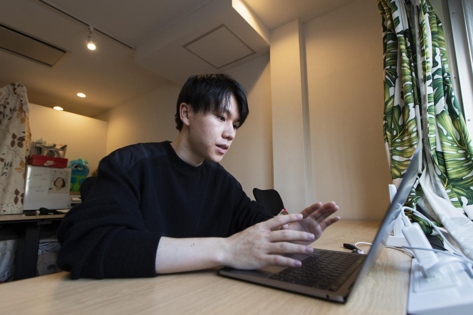 Koki Ozora, a college student who started a nonprofit called "Anata no Ibasho," or "A Place for You," talks with a woman who'd like to help Ozora's organization, as he speaks in his office in Tokyo on Friday, Oct. 2, 2020. Suicides are on the rise among Japanese teens and that worries 21-year-old Ozora, who grew up depressed and lonely. His online Japanese-language chat service, run entirely by volunteers, offers a 24-hour text-messaging counseling for those seeking a sympathetic ear, promising to answer every request, within five seconds for urgent ones. (AP Photo/Hiro Komae)