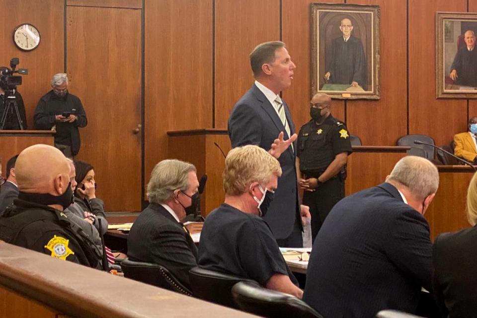 Suspended SC lawyer Alex Murdaugh, seated, head downcast, listens to lawyer Ronnie Richter describe his alleged crime in court Tuesday, Oct. 19, 2021 at Murdaugh’s bond hearing in Richland County, S.C.