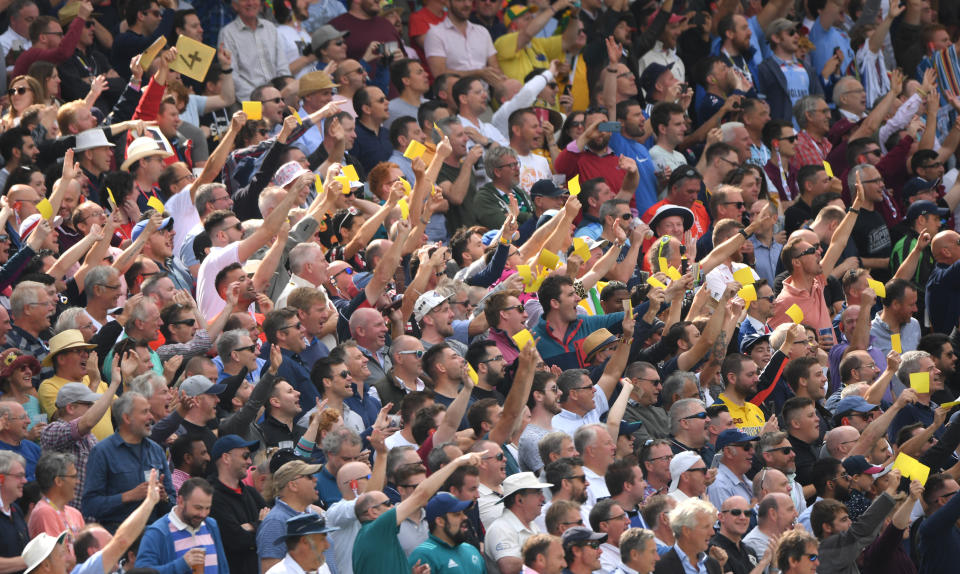 BIRMINGHAM, ENGLAND - AUGUST 01: The Hollie's stand wave off David Warner with sandpaper after he was dismissed during day one of the First Specsavers Ashes Test Match between England and Australia at Edgbaston on August 01, 2019 in Birmingham, England. (Photo by Stu Forster/Getty Images)