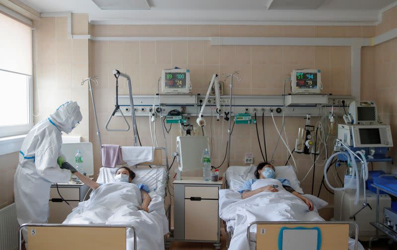 A medical specialist takes care of patients at a maternity ward of a hospital in Moscow