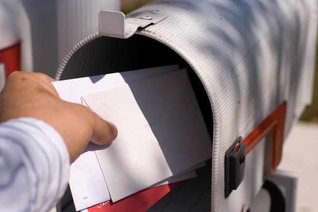 <p>Getty</p> Stock image of hand getting the mail