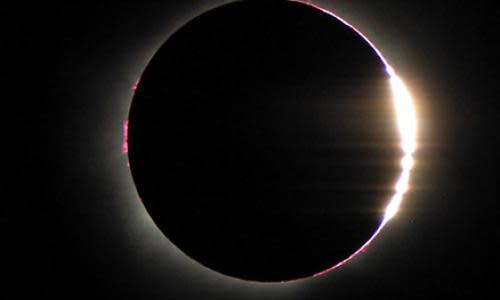 The Baily’s Beads effect is seen as the Moon makes its final move over the Sun during the total solar eclipse on Aug. 21, 2017 above Madras, Oregon. This effect occurs when gaps in the Moon’s rugged terrain allows sunlight to pass through in some places just before the total phase of the eclipse. Photo Credit: (NASA/Aubrey Gemignani)