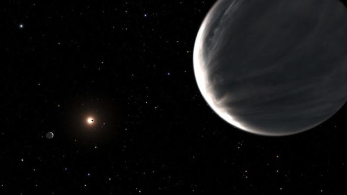 An artist’s rendition of the Kepler-138 system, with the Earth-like water world Kepler-138d in the foreground.