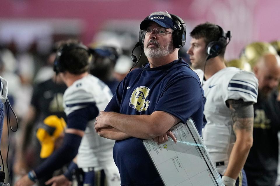 Akron football coach Joe Moorhead watches the first half against Indiana on Sept. 23 in Bloomington.