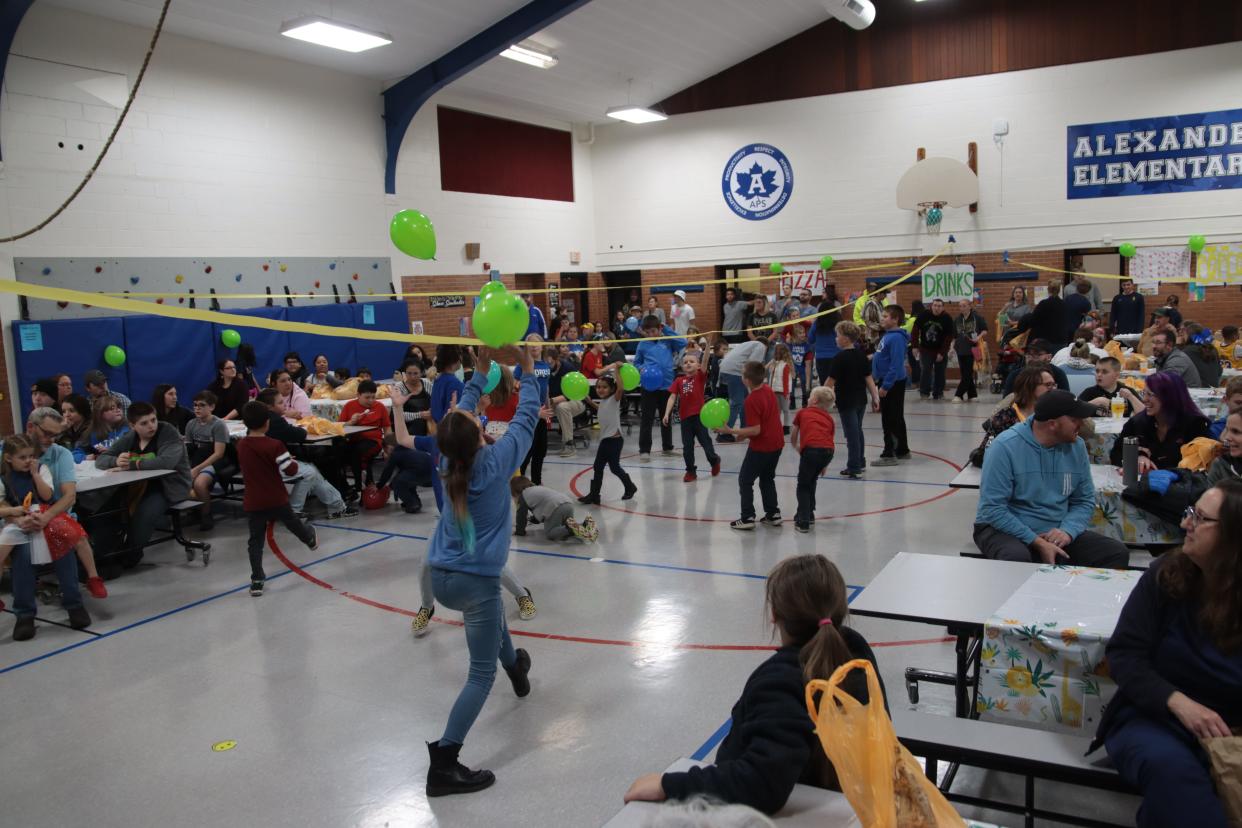 Alexander Elementary School students play an impromptu game of volleyball with balloons Nov. 11, 2022, during the Animal Kingdom of Kindness fall festival at the school.