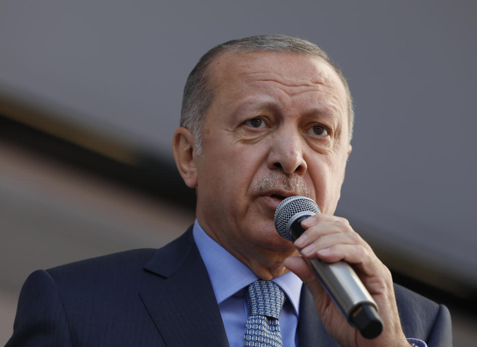 In this Thursday, March 14, 2019 photo, Turkey's President Recep Tayyip Erdogan addresses the supporters of his ruling Justice and Development Party, AKP, during a rally in Ankara, Turkey. Erdogan has condemned the attacks on mosques in the New Zealand city of Christchurch calling it the "latest example of rising racism and Islamophobia." (AP Photo/Burhan Ozbilici)