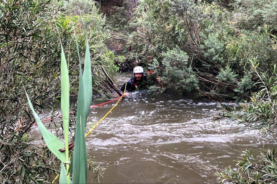 An emergency worker during a rescue operation in the midst of flood waters after heavy rain at the Buchan campground in east Gippsland, east of Melbourne (VICTORIA POLICE/AFP via Getty Im)