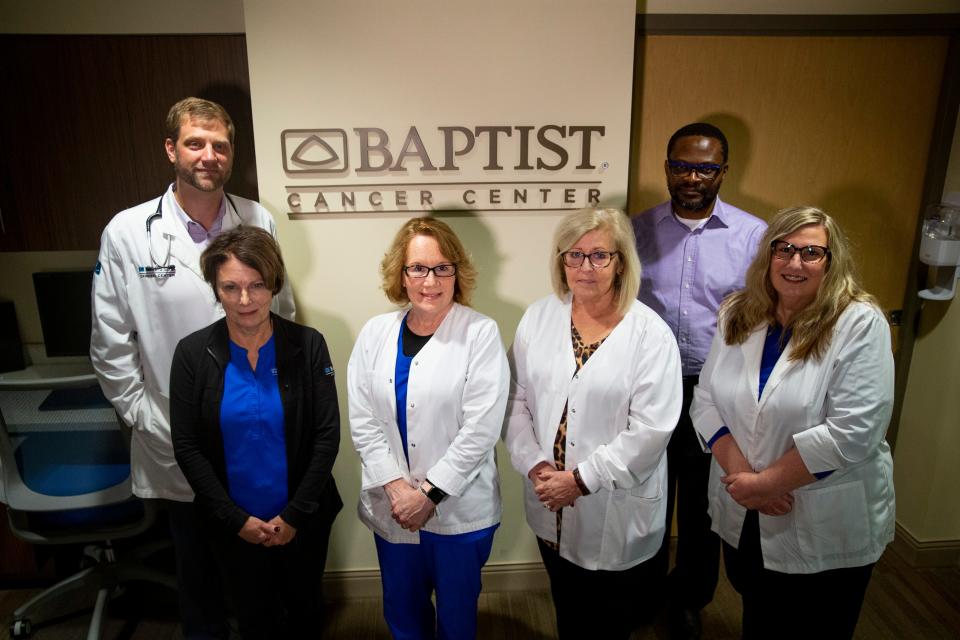 Dr. Phillip Lammers, Amanda Epperson, Laura McHugh, Kim Adams, Dr. Raymond Osarogiagbon and Christie Ellis, who are all staff within the multidisciplinary thoracic oncology program at Baptist Cancer Center, pose for a portrait at the center in Memphis, Tenn., on Thursday, November 16, 2023.