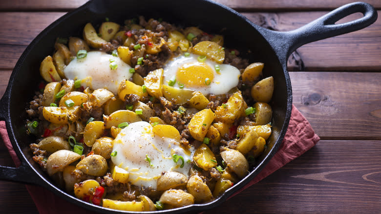Potatoes and eggs in cast iron skillet
