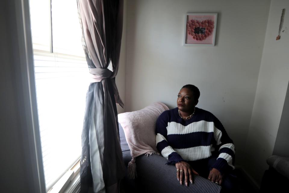 Desiree Chambers, 52, of Troy, N.Y. spent six weeks in the hospital after contracting COVID-19 in August of 2021. After being released from the hospital, her three adult children took turns staying with her in one-week week rotations. Chambers, photographed in her home April 6, 2022, says her children had to bathe her and cook for her, since along with being weakened from the virus, she was on supplemental oxygen twenty-four hours a day and could not go anywhere near a stove. She still suffers from severely limited lung capacity and weakness.