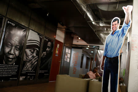 A cardboard cut-out of the jailed opposition leader Leopoldo Lopez is seen next to posters of the late former South Africa's President Nelson Mandela, Mother Teresa and Martin Luther King, Jr., at the office of the party Popular Will (Voluntad Popular) in Caracas, Venezuela January 18, 2017. Picture taken January 18, 2017. REUTERS/Carlos Garcia Rawlins