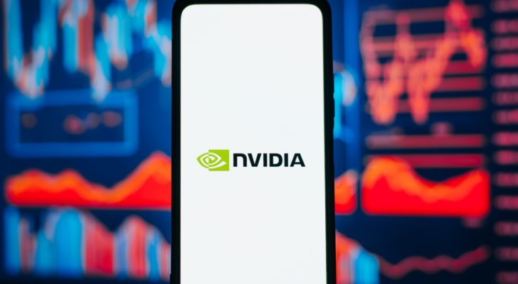 NVIDIA company logo on smartphone against background of red stock chart. Business crisis, collapse of trading and investment, bankruptcy, falling value concept. NVDA stock