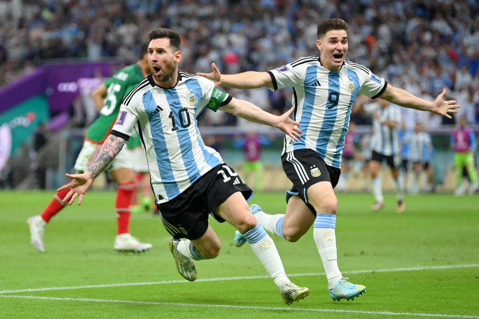 LUSAIL CITY, QATAR - NOVEMBER 26: Lionel Messi (L) of Argentina celebrates scoring their team's first goal with their teammate Julian Alvarez (R) during the FIFA World Cup Qatar 2022 Group C match between Argentina and Mexico at Lusail Stadium on November 26, 2022 in Lusail City, Qatar. (Photo by Dan Mullan/Getty Images)