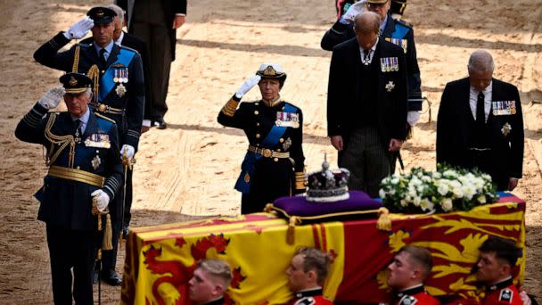 PHOTO: Britain's King Charles III, Britain's Prince William, Britain's Princess Anne, salute alongside Britain's Prince Andrew, as the coffin of Queen Elizabeth II, is carried into the Palace of Westminster, in London, Sept. 14, 2022.  (Ben Stansall/Pool via AP)