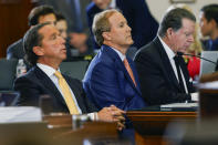 Texas state Attorney General Ken Paxton, center, sits with his attorneys Dan Cogdell, right, and Tony Buzbee, left, during his impeachment trial in the Senate Chamber at the Texas Capitol, Tuesday, Sept. 5, 2023, in Austin, Texas. (Juan Figueroa/The Dallas Morning News via AP, Pool)