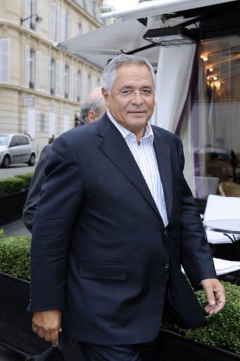 French-Lebanese lawyer Robert Bourgi walks in a street outside Europe 1 radio station in Paris. African leaders gave French former president Jacques Chirac and possible presidential candidate Dominique de Villepin $20 million in cash, including to finance elections, Bourgi has said