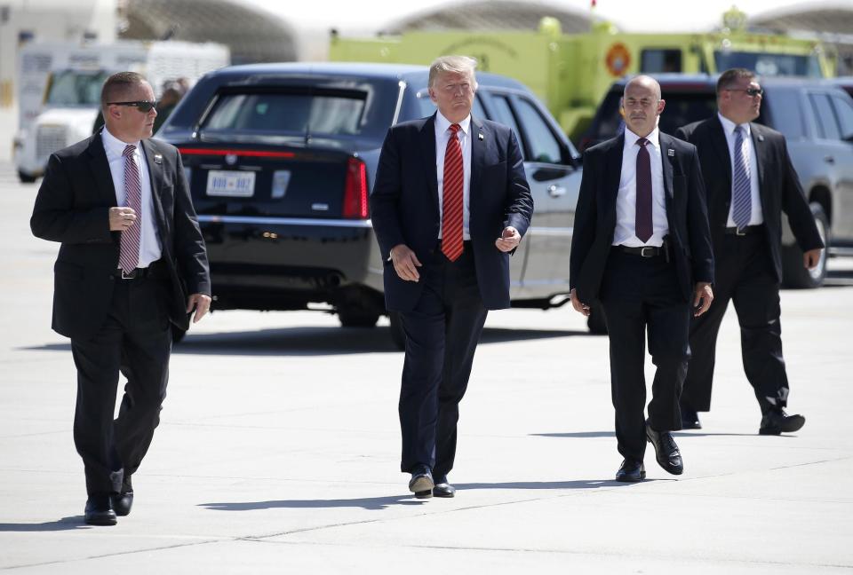 Then-US President Donald Trump walks with Secret Service agents in Yuma, Arizona, in August 2017.