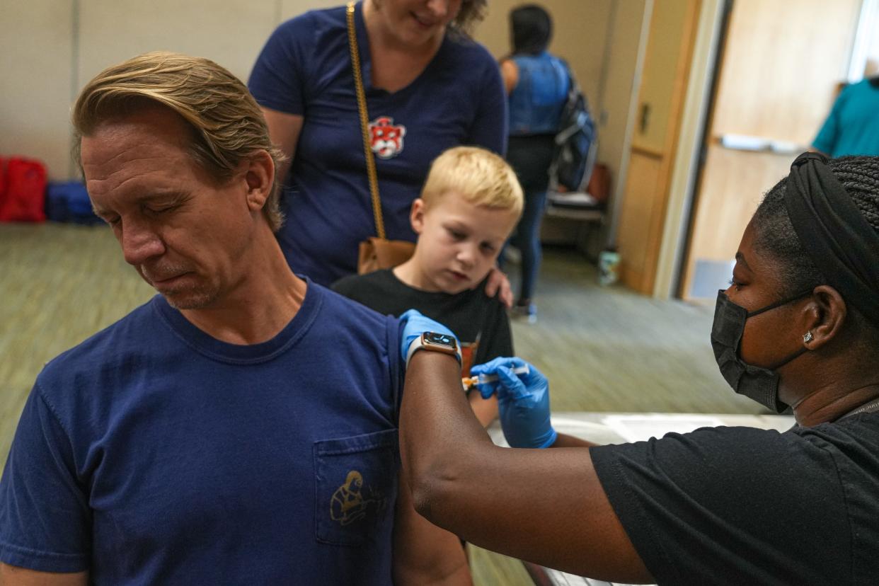 Christopher Garrison gets a flu shot at the second annual Austin Independent School District Showcase at the Palmer Events Center on Sep. 23, 2023 in Austin. Families attending the event were able to sign up for a free updated flu shot on the second floor of the Palmer Events Center.