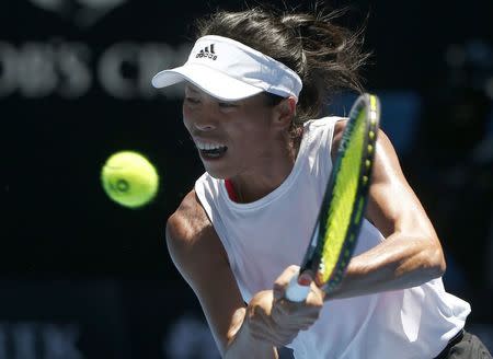 Tennis - Australian Open - Rod Laver Arena, Melbourne, Australia, January 18, 2018. Hsieh Su-Wei of Taiwan hits a shot against Garbine Muguruza of Spain. REUTERS/Thomas Peter