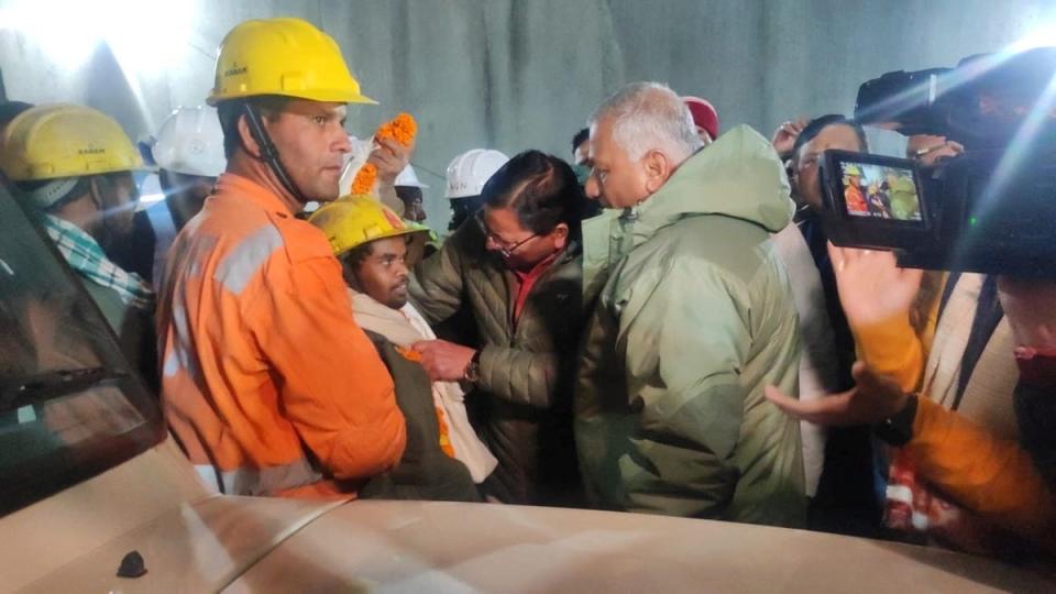 One of the trapped workers is checked out after he was rescued from the collapsed tunnel site (via REUTERS)