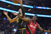 Golden State Warriors forward Otto Porter Jr. (32) grabs the ball in front of Portland Trail Blazers forward Tony Snell (17) during the first half of an NBA basketball game in San Francisco, Wednesday, Dec. 8, 2021. (AP Photo/Jeff Chiu)