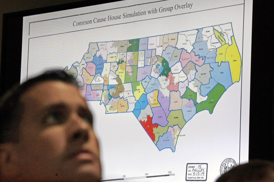 FILE - In this Monday, July 15, 2019 file photo, a state districts map is shown as a three-judge panel of the Wake County Superior Court presides over the trial of Common Cause, et al. v. Lewis, et al, in Raleigh, N.C. Fresh off sweeping electoral victories a decade ago, governors and lawmakers in several states used new census data to redraw voting districts for Congress and state legislatures that were intended to help their party remain in power for years to come. Those efforts largely paid off, particularly for Republicans. An Associated Press analysis designed to detect the effects of gerrymandering shows that Republicans enjoyed a greater political advantage in more states over the past decade than either party had over the past 50 years. (AP Photo/Gerry Broome, File)