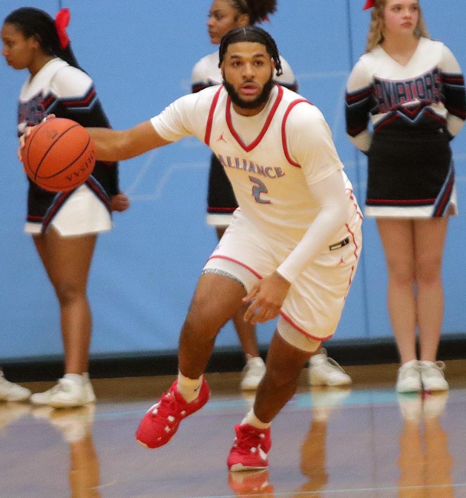 Alliance's K'Vaughn Davis brings the ball down court against West Branch, Friday, Jan. 26, 2024.