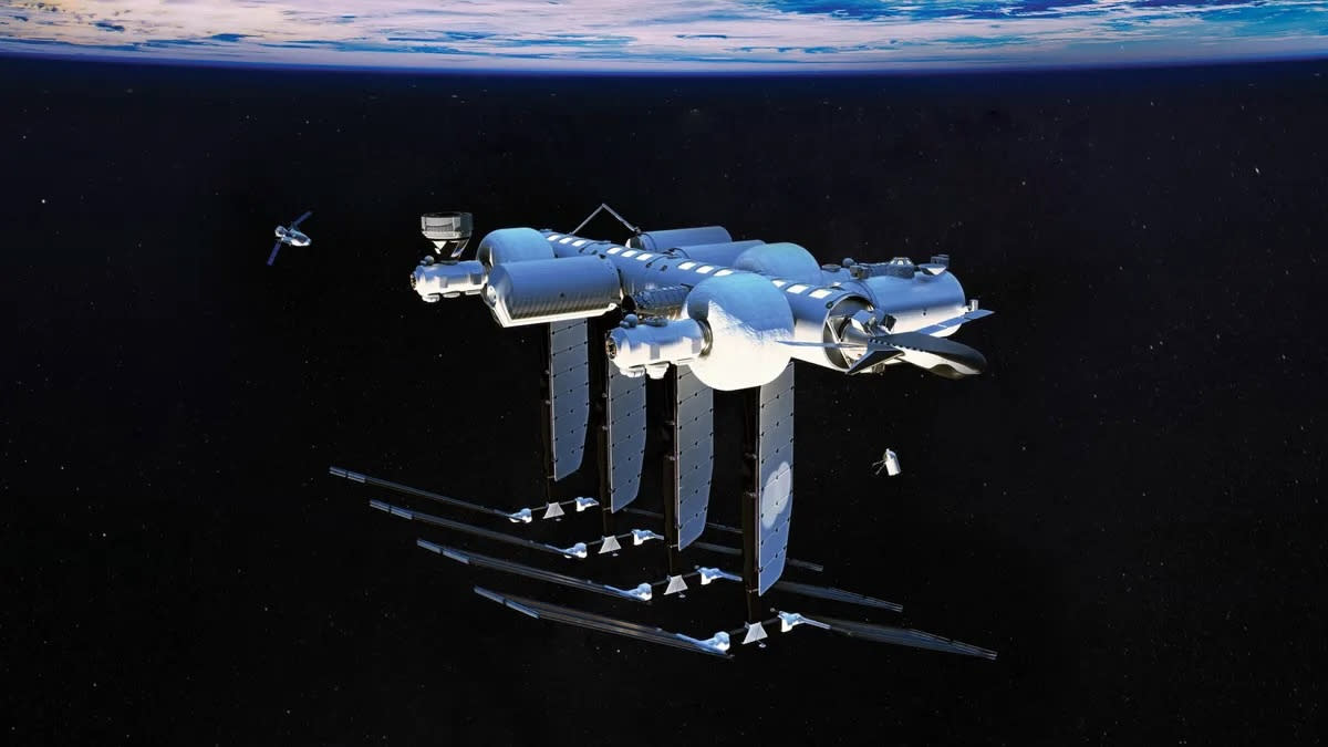  Illustration of a silver-white space station with the curve of earth in the background. . 
