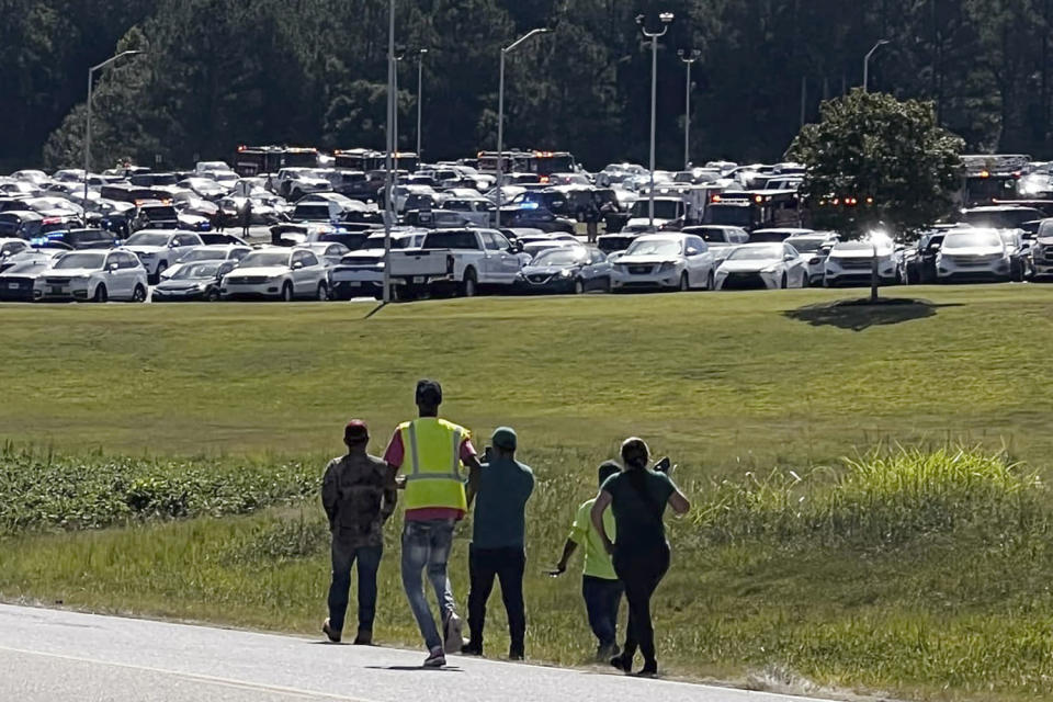 Students are evacuated to the football stadium after the Apalachee High School campus in Georgia was placed on lockdown Wednesday. (Erin Clark / AP)