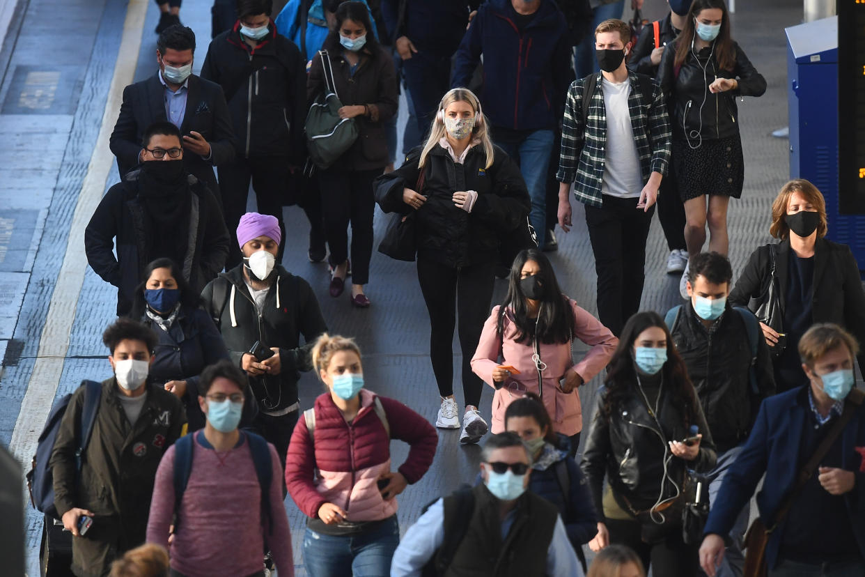 Commuters at Waterloo Station, in London, at 08:54hrs on Thursday, after Prime Minister Boris Johnson announced a range of new restrictions to combat the rise in coronavirus cases in England.