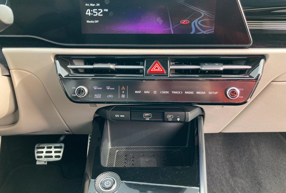A touchscreen strip in the Kia Niro EV electric SUV showing buttons for the volume and climate settings.
