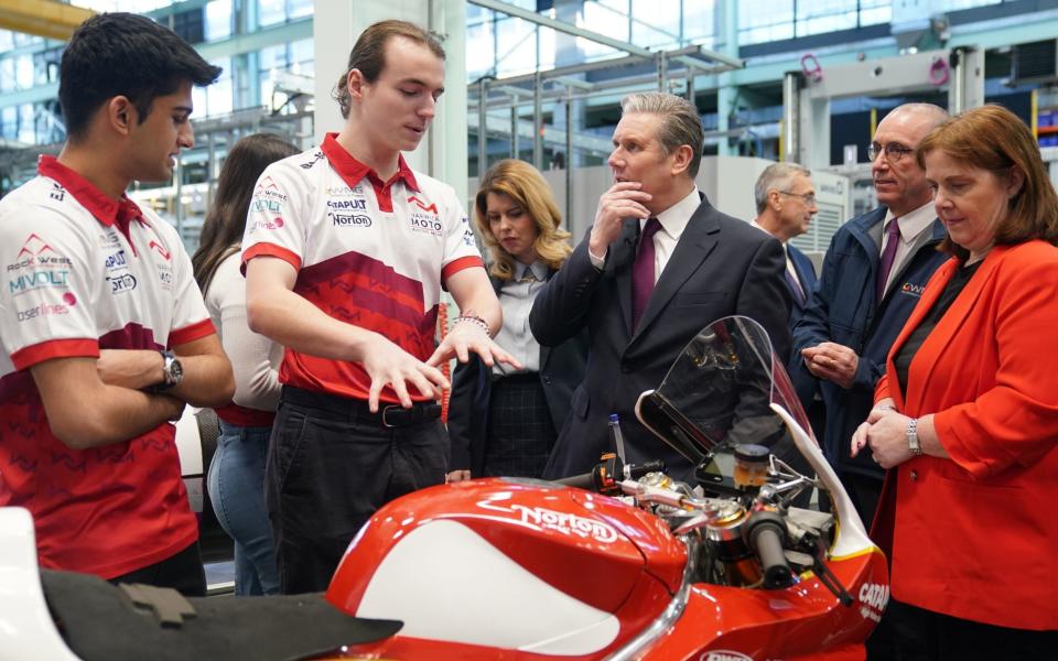 Labour leader Sir Keir Starmer is shown an electric racing motorcycle during a visit to Warwick University in Coventry