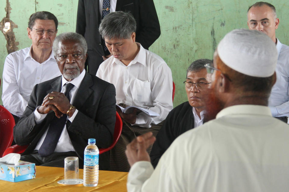 FILE - In this Sept. 27, 2016 file photo, former United Nations Secretary-General Kofi Annan, second left, listens to a Rohingya religious and community leader in the Internally Displaced People's camps during a visit by the Rakhine Advisory Commission in Thetkabyin village, outside Sittwe, the capital of Rakhine state in Myanmar. Annan left the U.N. far more committed to combating poverty, promoting equality and fighting for human rights _ and until his death Saturday, Aug. 18, 2018, he was speaking out about the turbulent world he saw moving from nations working together to solve problems to growing nationalism. (AP Photo/Esther Htusan)
