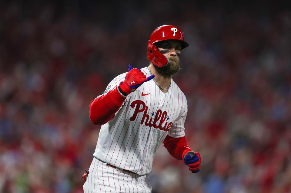 Phillies designated hitter Bryce Harper hits a two run home run against the Astros in the first inning.