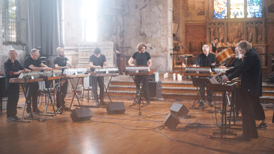 The 10 musicians of the Will Gregory Moog Ensemble playing the Minimoog Model D synthesizer.