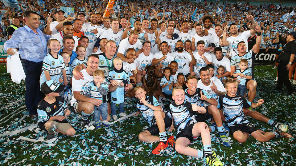 The Sharks pose for a team photo as they celebrate victory after the 2016 NRL Grand Final. (Photo by Mark Kolbe/Getty Images)