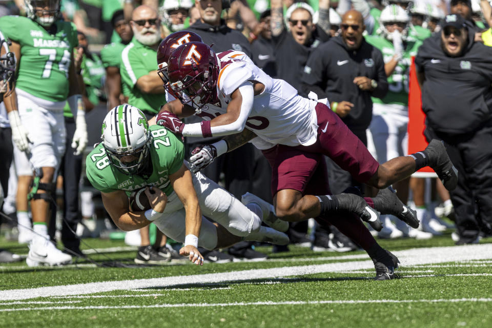 Marshall running back Ethan Payne (28) catches a pass up the sideline as the Herd takes on Virginia Tech during an NCAA college football game, Saturday, Sept. 23, 2023, at Joan C. Edwards Stadium in Huntington, W.Va. (Sholten Singer/The Herald-Dispatch via AP)