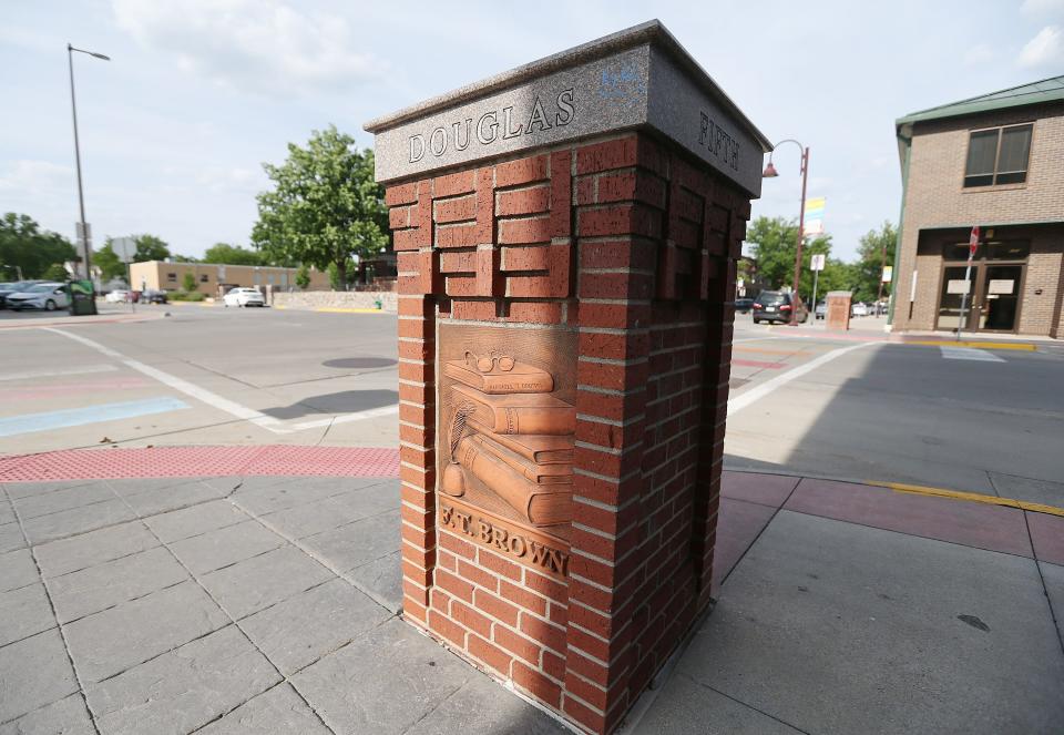 This pier at the corner of Douglas Avenue and Fifth Street pictured Tuesday, June 13, 2023, honors Farwell Tilden Brown, an Ames native and real estate appraiser for the Iowa Department of Transportation. However, his vocation was Ames History. He founded the Ames Historical Society and published four books on Ames history.