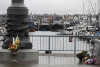 Fishing and boats used for other purposes are shown parked near the Seattle Fishermen's Memorial, Thursday, Jan. 2, 2020, in Seattle. Items left at the memorial Thursday included a ball cap with the name of the crab fishing boat Scandies Rose, a 130-foot crab fishing boat from Dutch Harbor, Alaska, that sank on New Year's Eve. (AP Photo/Ted S. Warren)