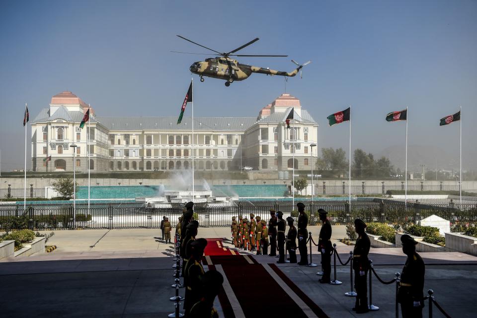 An Afghan Air Force helicopter flies over ahead of the arrival of Afghanistan's President Ashraf Ghani for the introduction of ministerial nominees at the Parliament in Kabul on Oct. 21, 2020. (Photo: WAKIL KOHSAR via Getty Images)
