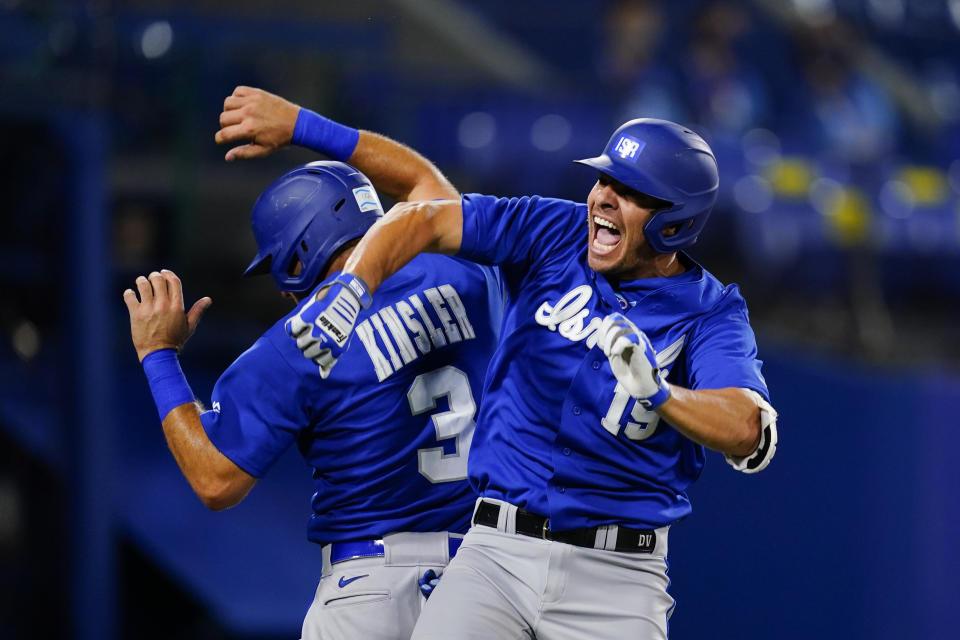 Israel's Danny Valencia, right, celebrate with Ian Kinsler after hitting a two run home run during the eight inning of a baseball game against the Dominican Republicat at the 2020 Summer Olympics, Tuesday, Aug. 3, 2021, in Yokohama, Japan. (AP Photo/Matt Slocum)