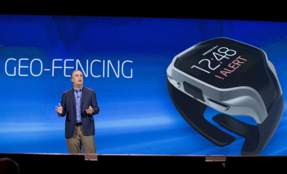 Intel CEO Brian Krzanich talks about geo-fencing in a wearable tracker during a keynote address at the Consumer Electronics Show, Monday, Jan. 6, 2014, in Las Vegas. (AP Photo/Julie Jacobson)