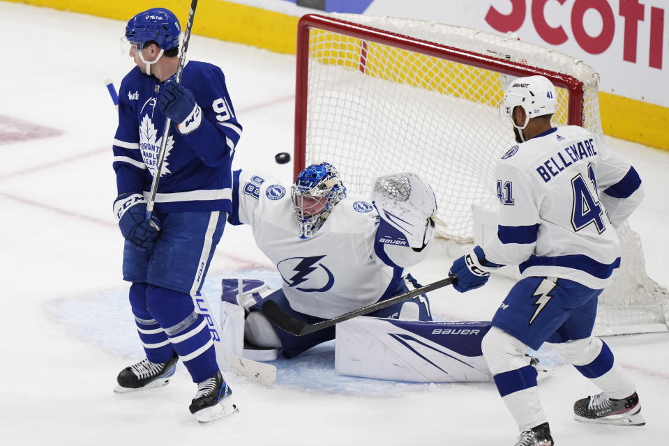 Tampa Bay Lightning goaltender Andrei Vasilevskiy (88) gives up a goal to Toronto Maple Leafs right wing William Nylander, not seen, as Maple Leafs forward John Tavares (91) and Lightning left wing Pierre-Edouard Bellemare (41) watch during the second period of Game 1 of a first-round NHL hockey playoff series Tuesday, April 18, 2023, in Toronto. (Frank Gunn/The Canadian Press via AP)