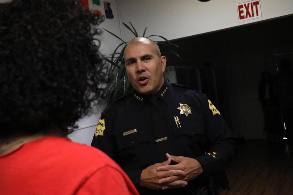 Fresno Police Chief Paco Balderrama speaks with Tracie Cisneros, volunteer coordinator for Fresno Rainbow Pridef, after the anti-hate roundtable discussion hosted by California Attorney General Rob Bonta on Tuesday, Sept. 12 in Fresno.