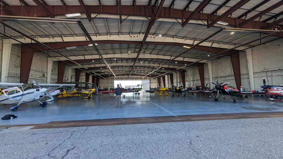 Several aircraft sit inside Hangar 509 at the Salina Regional Airport. Each of these planes are taking part in the 2023 U.S. National Aerobatic Championships, which has 85 pilots competing in various categories.