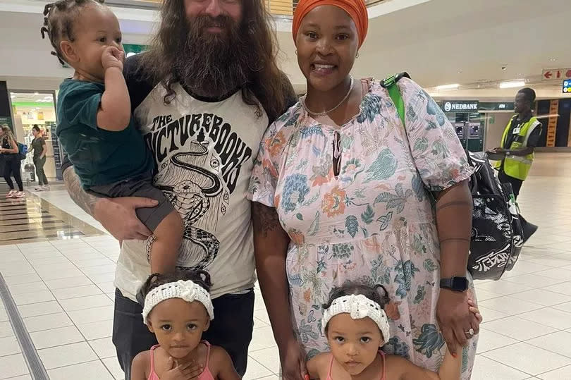 Carl Wylie with his wife Zandile and their three children