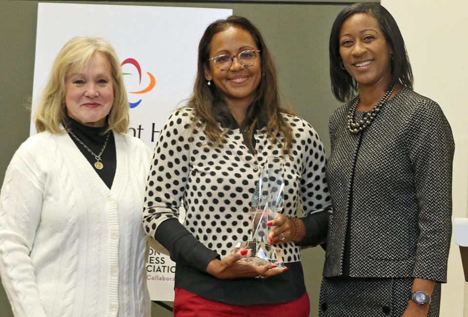 Duke Energy director Martha Wegner, left, and Gastonia City Councilwoman Donyel Barber, right, present the second Duke Energy Leadership & Citizenship Award to Dr. Crystal Maddox Bowe during the Gaston Business Association Annual Meeting & Celebration held Friday, Dec. 2, 2022 at the Gastonia Conference Center.