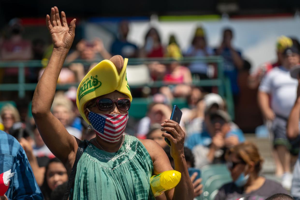 Spectators cheer at Maimonides Park for the 2021 Nathan's Famous 4th Of July International Hot Dog Eating Contest at Coney Island on July 4, 2021, in New York City.