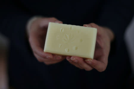 California "weed nun" Desiree Calderon, who goes by the name Sister Freya, holds soap made from hemp at Sisters of the Valley near Merced, California, U.S., April 18, 2017. REUTERS/Lucy Nicholson