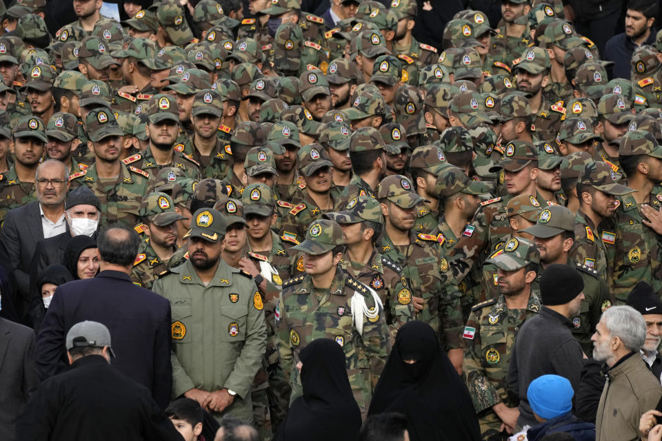 Iranian army cadets and officers attend the funeral ceremony of Seyed Razi Mousavi, a high ranking Iranian general of the paramilitary Revolutionary Guard, who was killed in an alleged Israeli airstrike in Syria on Monday, in Tehran, Iran, Thursday, Dec. 28, 2023. (AP Photo/Vahid Salemi)